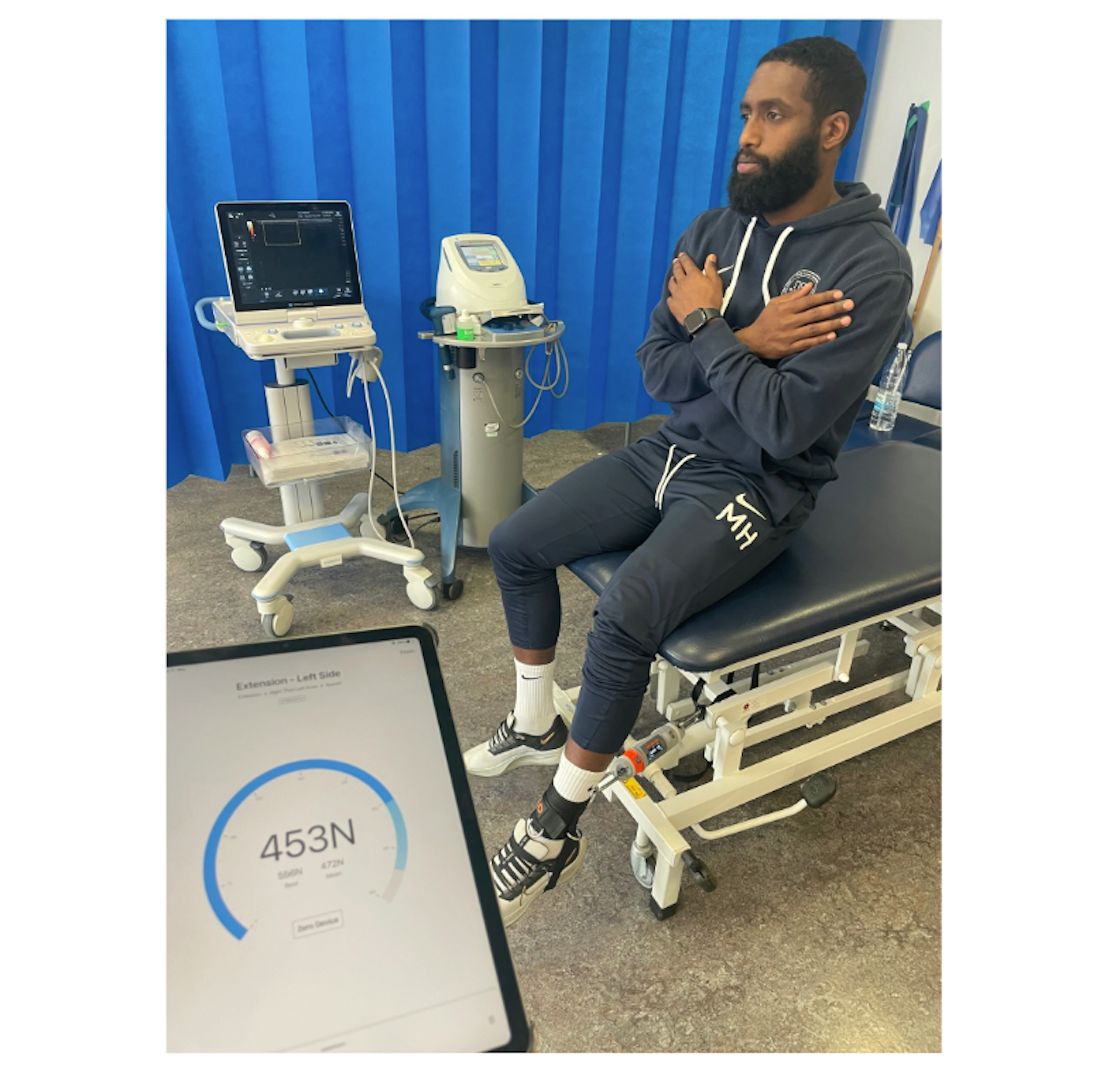 Physiotherapist Zubair Haleem conducting knee extension strength using DynaMo Plus at Barts Health (NHS Trust)