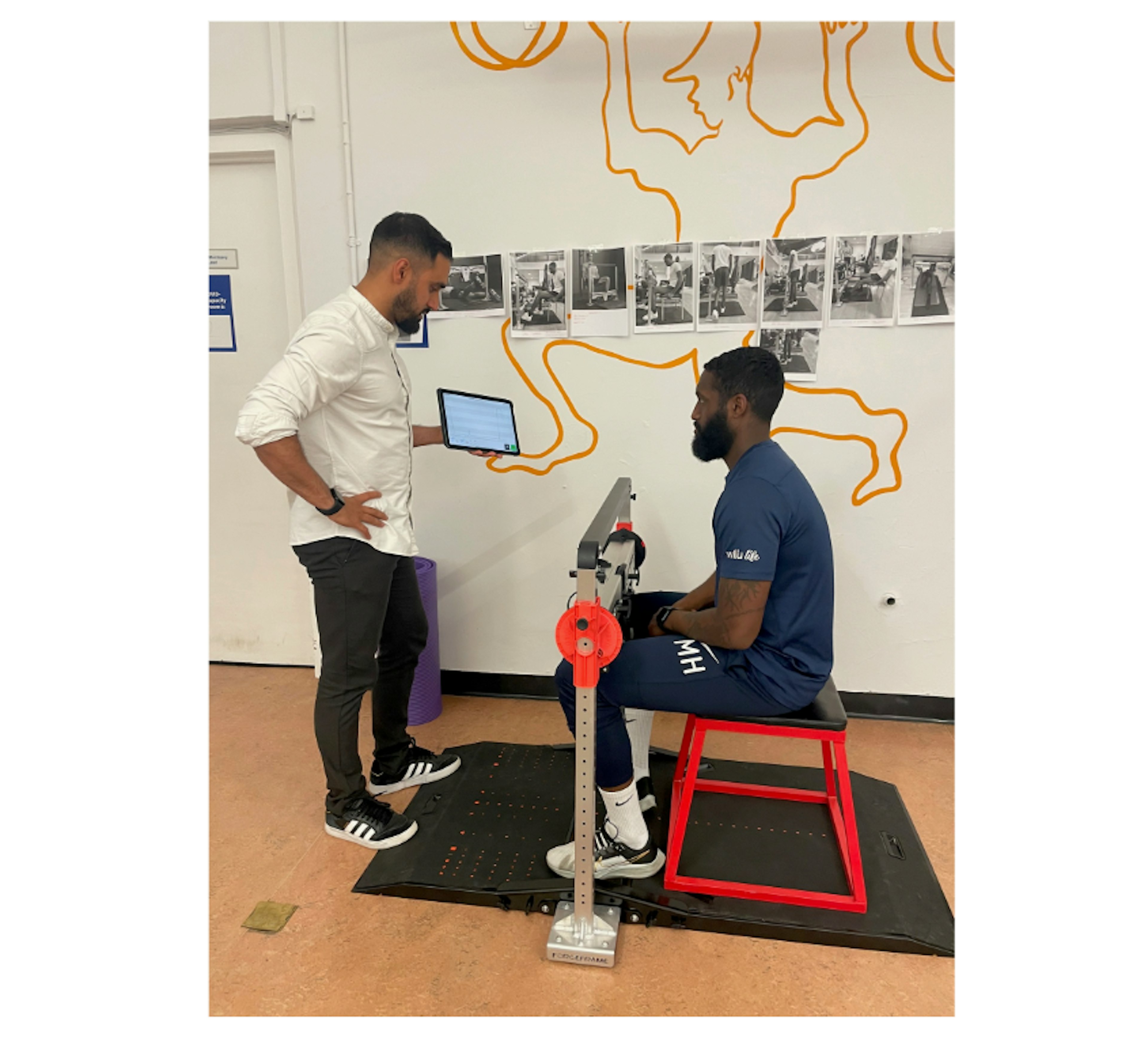Physiotherapist Zubair Haleem conducting strength testing on ForceFrame at Barts Health (NHS Trust)
